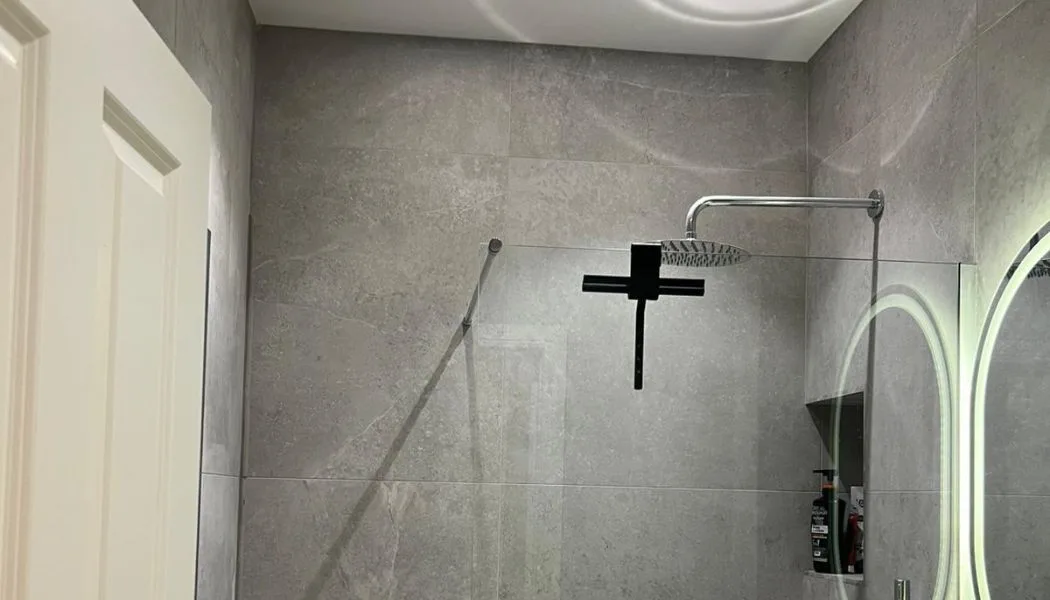 This full bathroom renovation project features a modern design, blending sleek fixtures and contemporary finishes. The transformation includes a complete overhaul of plumbing, tiles, and layout, creating a luxurious and functional space. Whether upgrading a small powder room or a spacious master bath, our expert team at Beck's Homes UK brings your vision to life with precision and style.