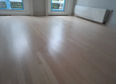 Professional flooring installation in a modern Central London home by Beck's Homes UK, featuring high-quality wooden flooring and expert workmanship.