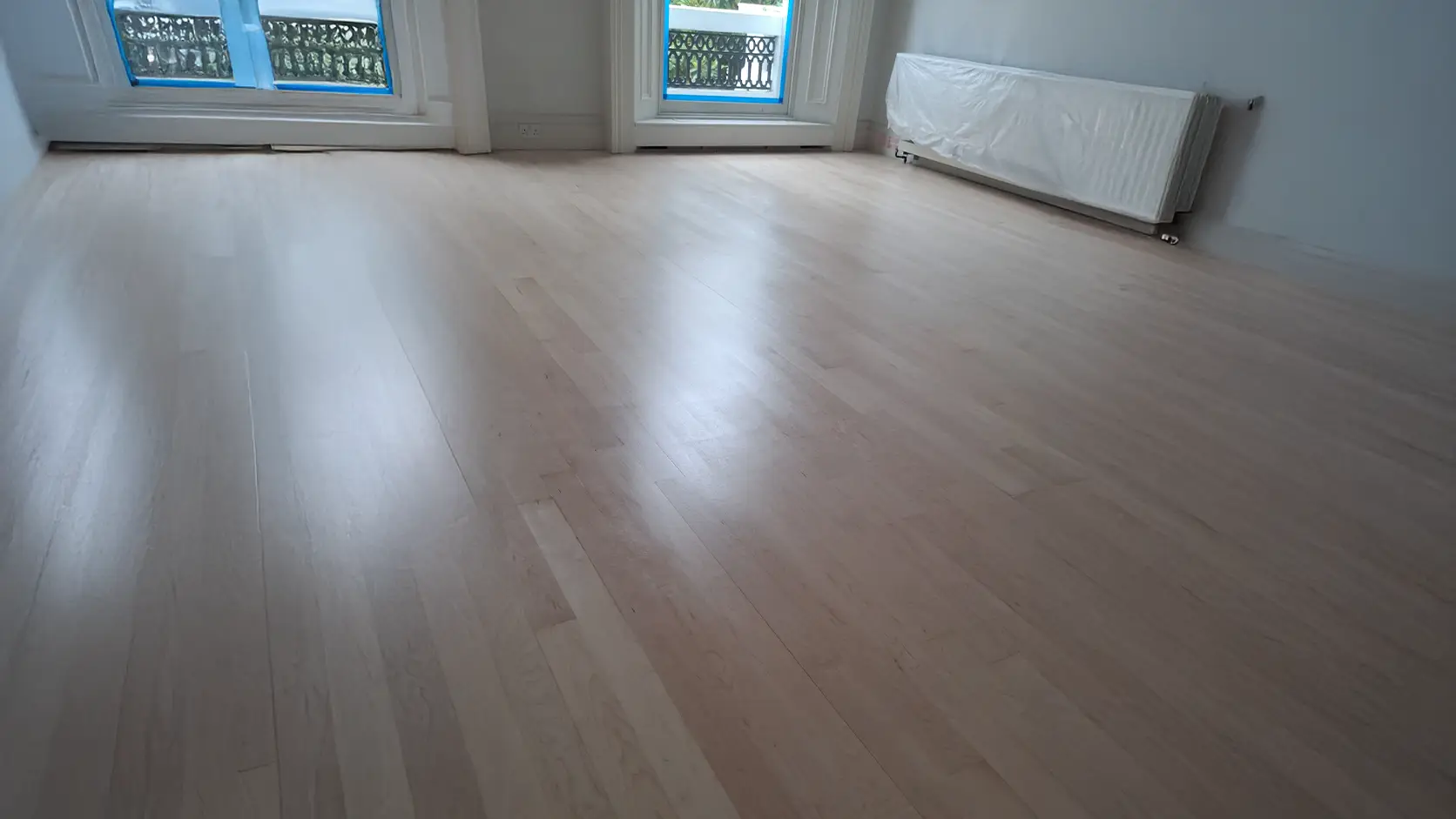 Professional flooring installation in a modern Central London home by Beck's Homes UK, featuring high-quality wooden flooring and expert workmanship.