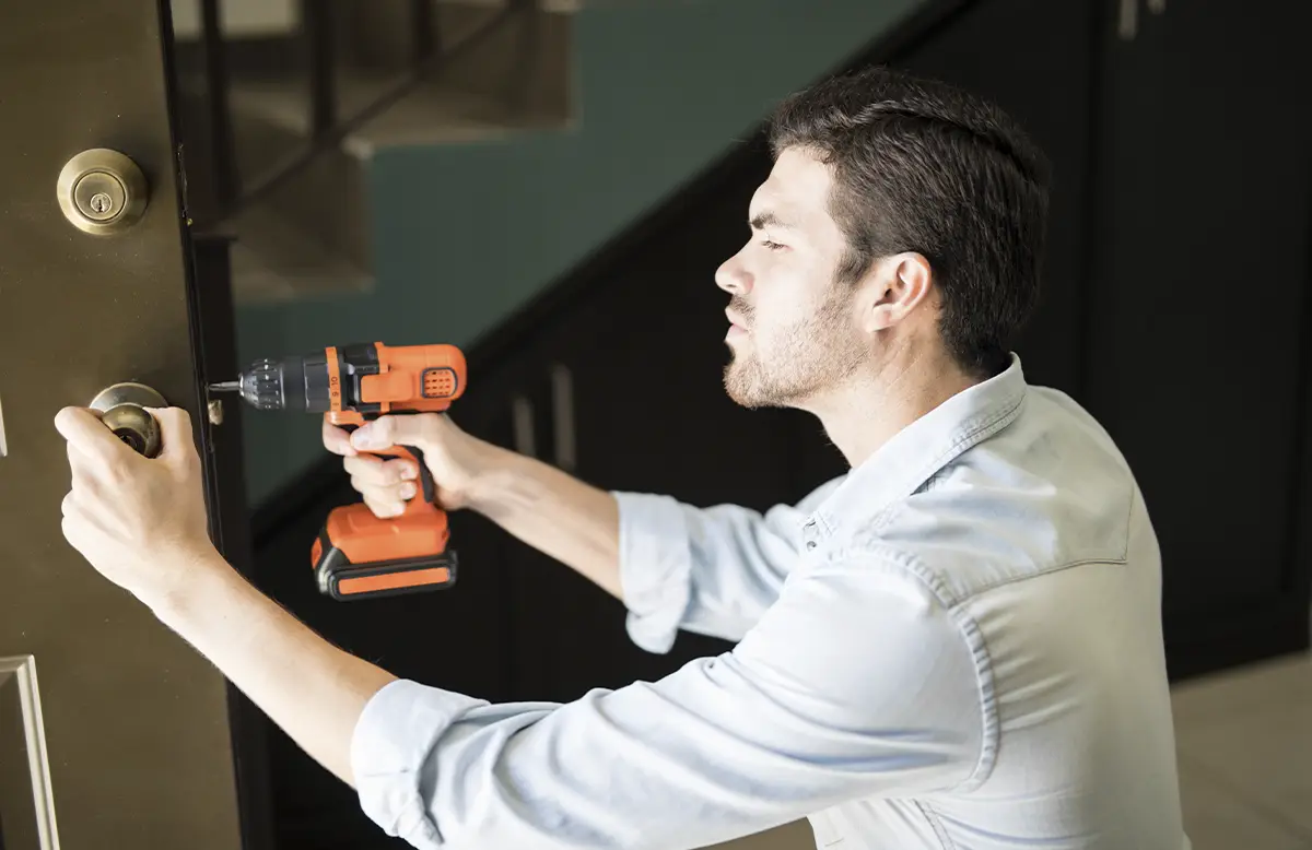 handyman fixing loose cabinet door and minor household repairs