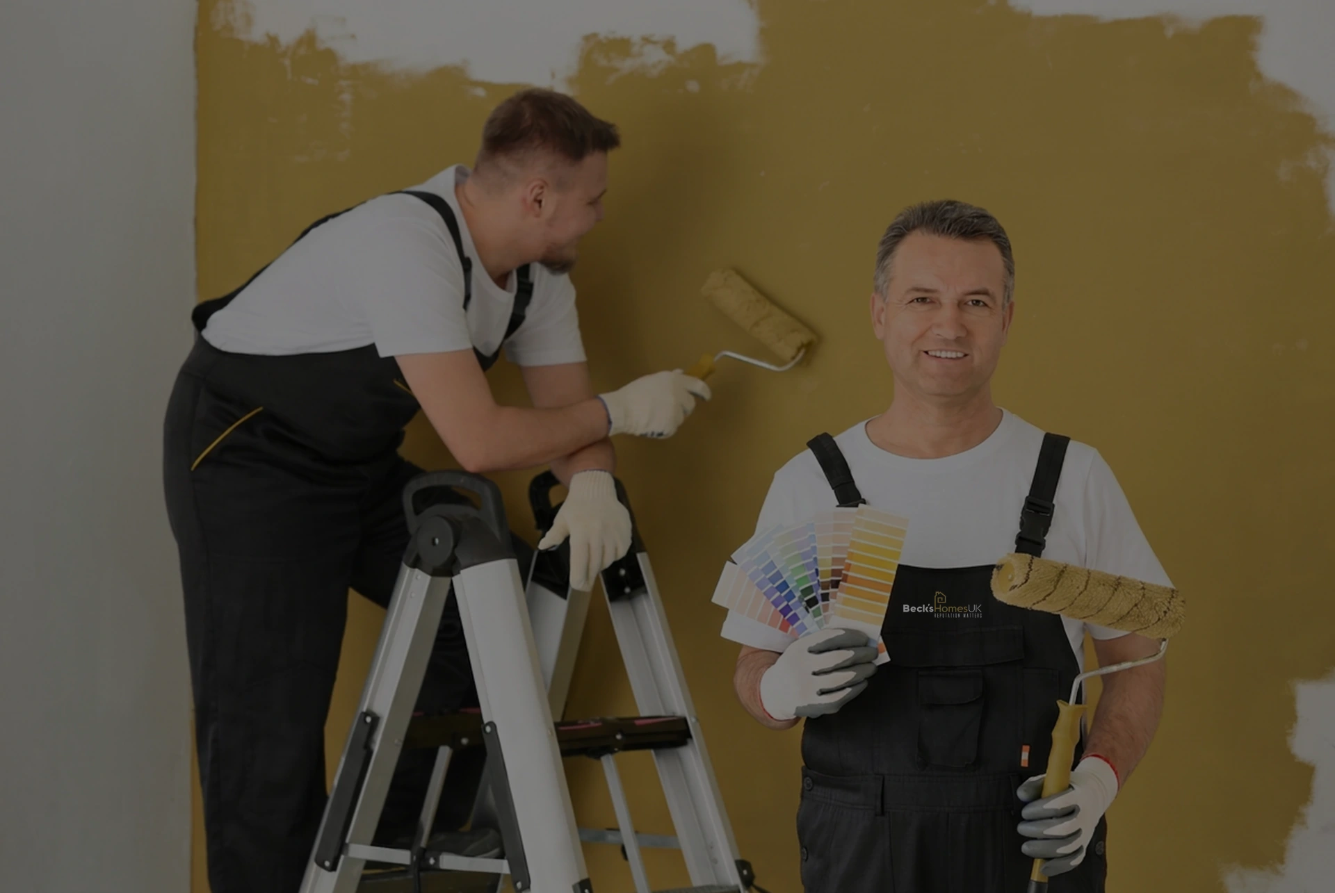 Beck's Homes UK painters decorating an interior wall with a roller and colour swatches in London